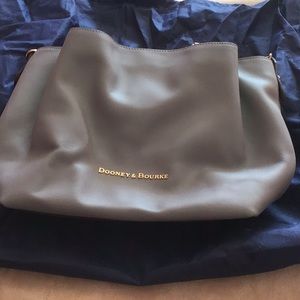 Brand new Dooney and Burke gray leather handbag.